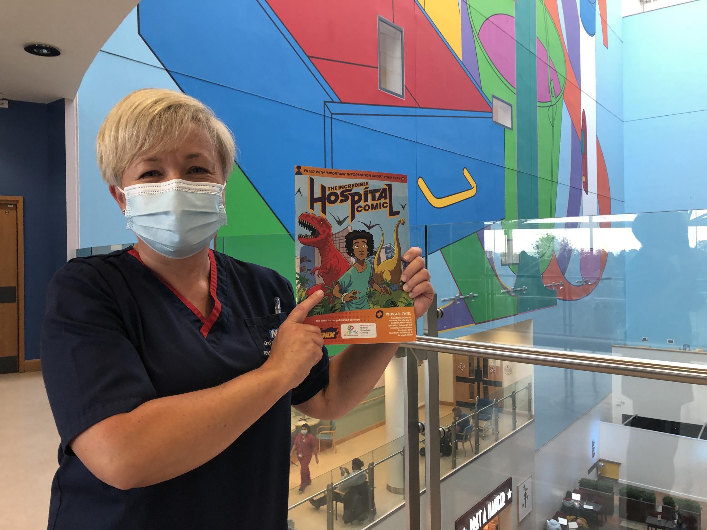 Oxford Childrens Hospital Matron Zoe Pooley with the special Phoenix comic Picture: Oxford Hospitals Charity 
