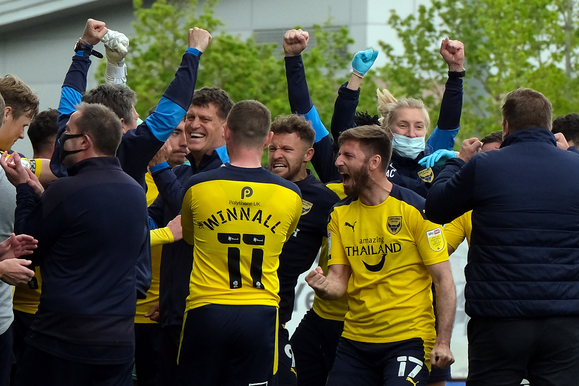 United players and staff celebrate making it into the play-offs after the 4-0 win against Burton Albion Picture: Ric Mellis