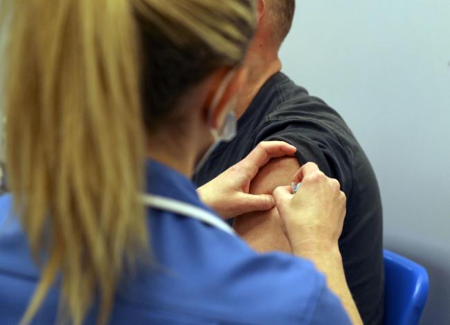 File photo of a person receiving a Covid-19 jab. Picture: Steve Parsons/PA Wire