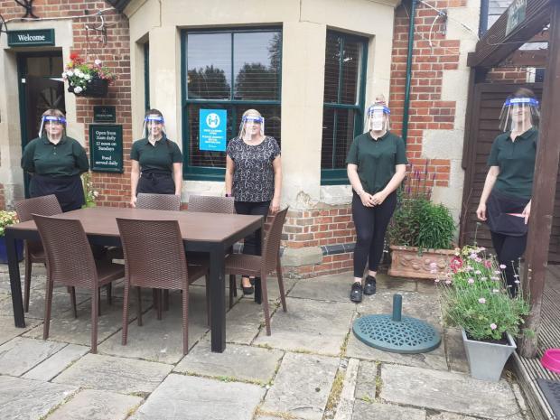 Staff outside The Plough in Wolvercote in 2020