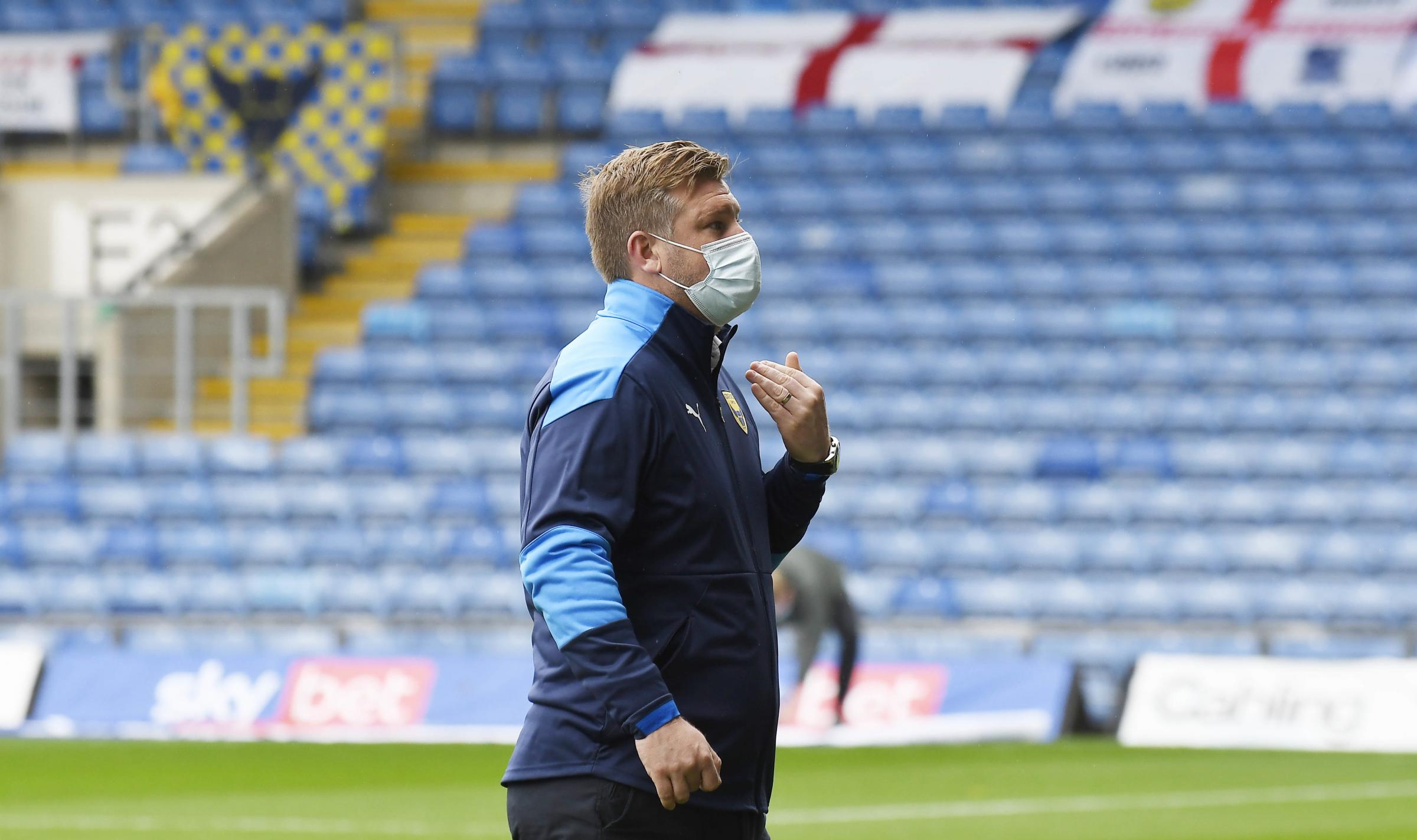 Karl Robinson signals that the match against Crewe Alexandra has been called off Picture: David Fleming