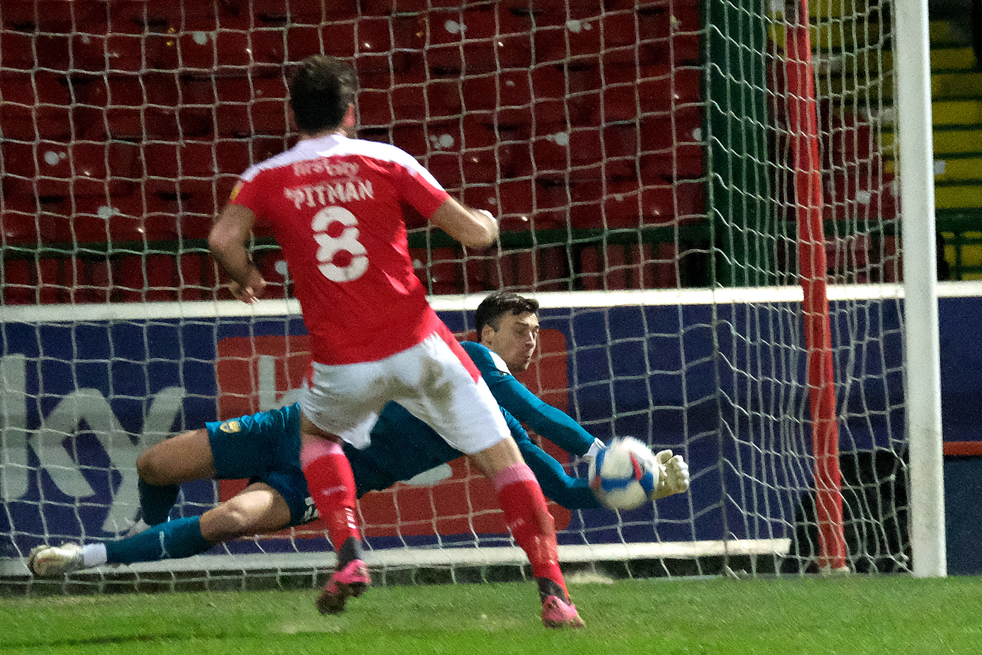 Jack Stevens saves a penalty for the second game running at Swindon Town Picture: Ric Mellis