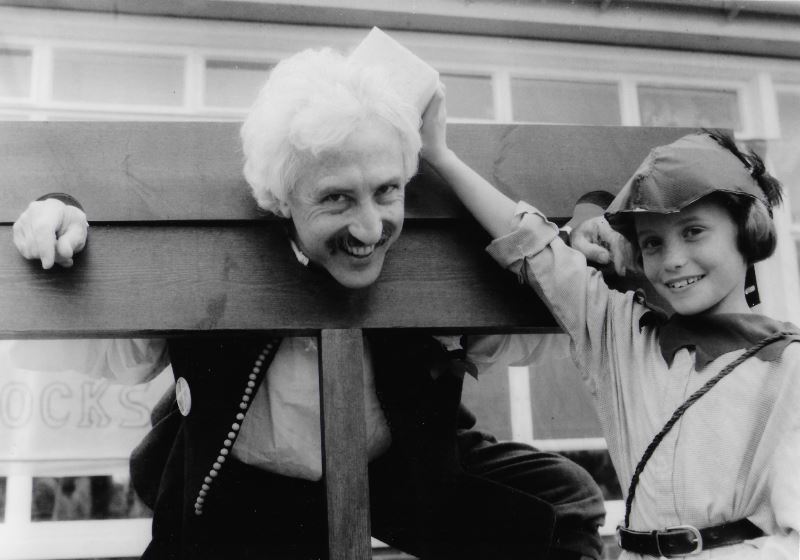 Louise Howkins, nine, of Farmoor, gives Bill a soaking in the stocks at Cumnor medieval fayre in 1990