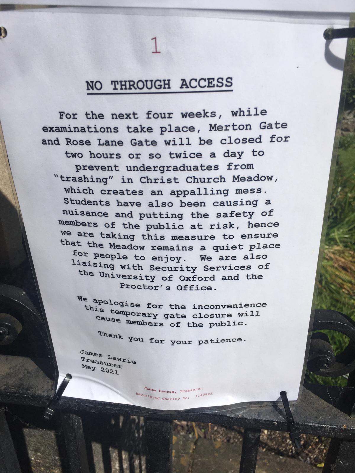 A notice at the gate of Christ Church Meadow explaining it is closed due to trashing.