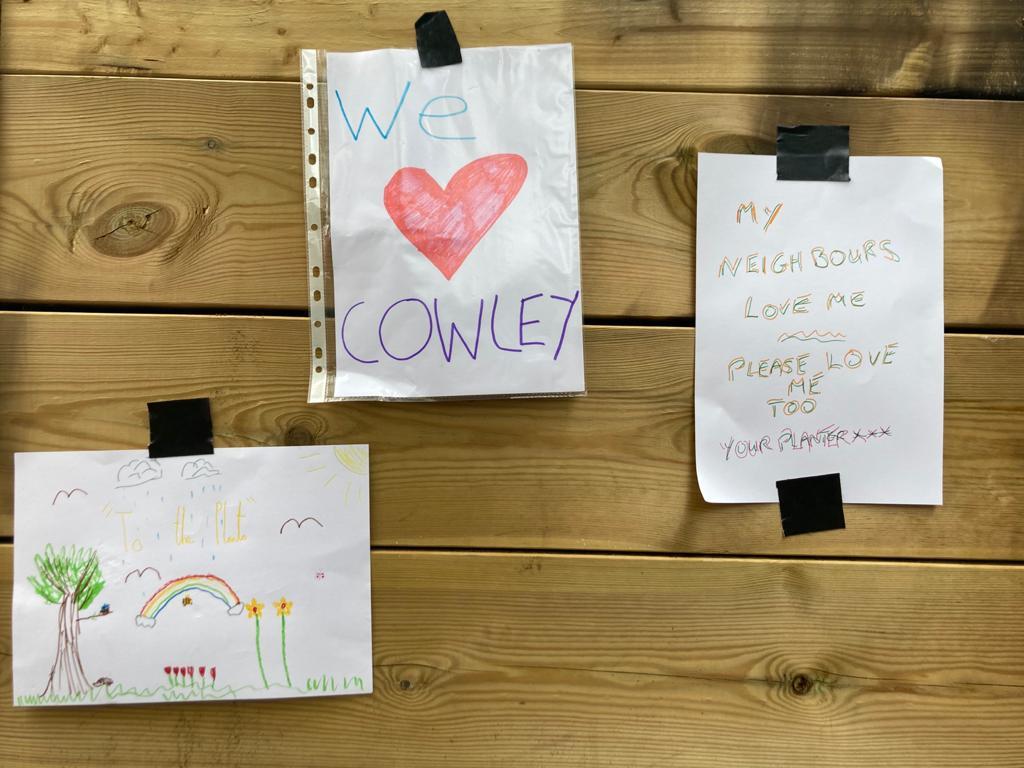 Notes left by children on the burned LTN planter. Picture: Charlie Hicks