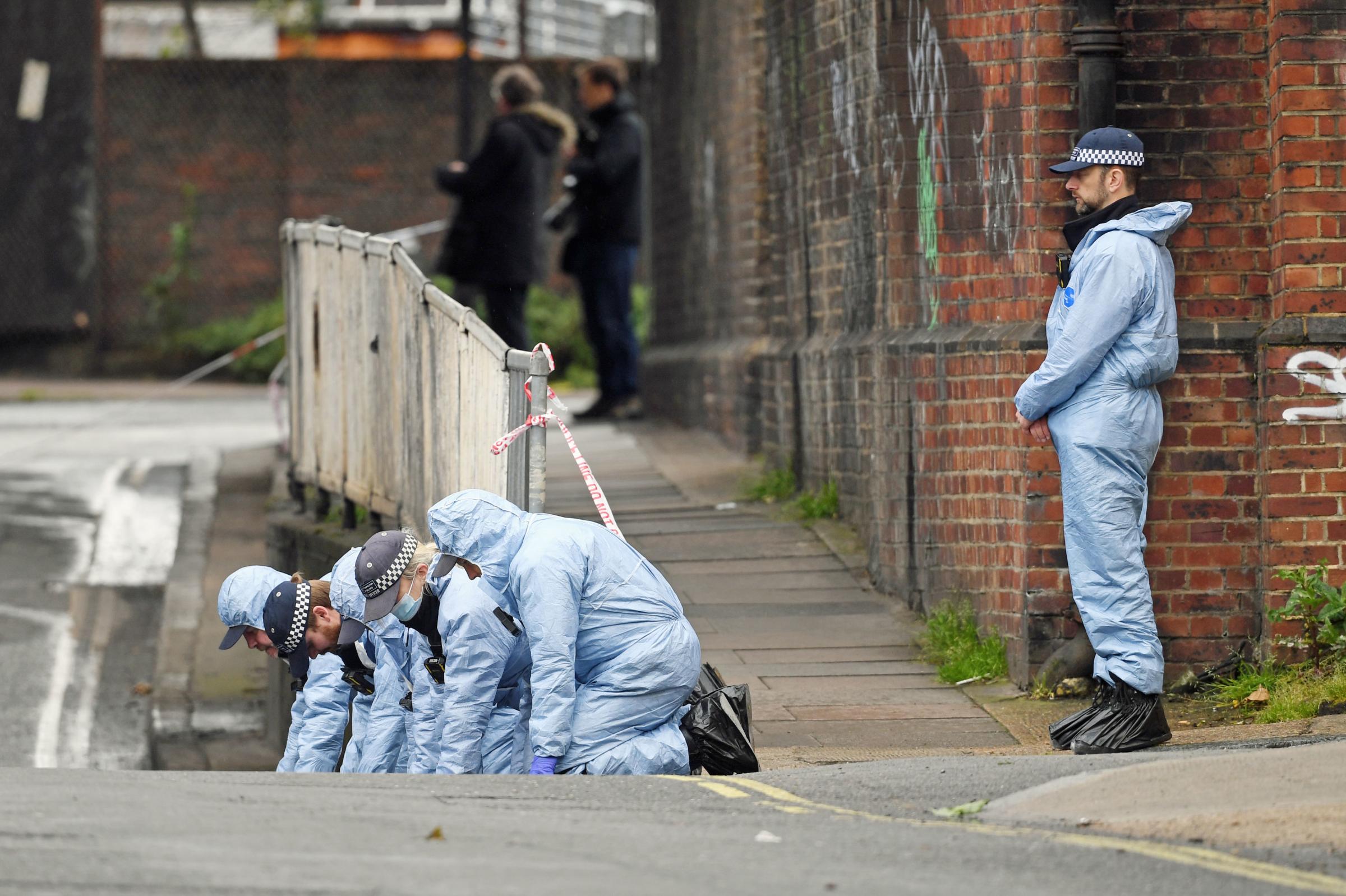 Police forensic officers search a street in Peckham, southeast London, close to where black equal rights activist Sasha Johnson was shot in the head during the early hours Picture: Kirsty OConnor/PA Wire
