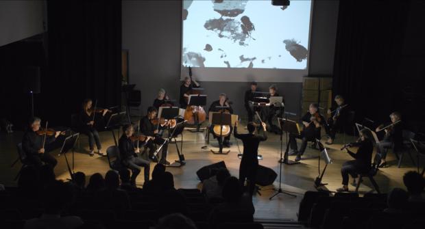 Oxford Mail: The orchestra performs during the premiere at Oxford Spires Academy. Picture: Ross Harrison