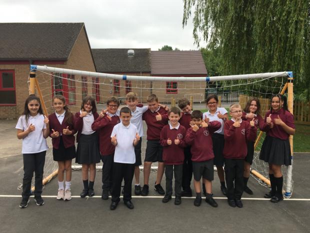 Oxford Mail: West Witney Primary School pupils give the new building a thumbs up