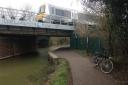 An Oxford to Marylebone train passes over the Oxford Canal and its newly improved towpath