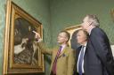 Curator Colin Harrison, left, shows the Millais painting of Ruskin to Ashmolean Museum director Christopher Brown, centre, and Hedley Swain, of Arts Council England in 2013. Picture: Antony Moore