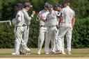 Adam Stapleford-Jones is congratulated after taking a catch for Bicester & North Oxford      Pictures: Richard Cave