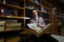 Oxford Mail news editor Pete Hughes with some of the many books in the Oxford Mail library at Osney Mead. 			                    Picture: Ed Nix
