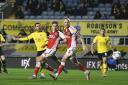 Nathan Holland sweeps home Oxford United's third goal Picture: David Fleming