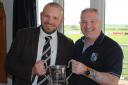 Chinnor’s George White receives the Oxfordshire Cup from Oxfordshire RFU President, Pete Bramley Picture: Chinnor RFC Thame