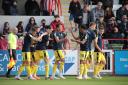 Kyle Joseph is celebrated after scoring his first goal in the win at Exeter. Picture: Darrell Fisher