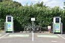 A bike at Eynsham's electric car charging points Photo: Ian White
