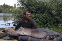 Richard Cooke caught a record 112lb catfish at Linear Fisheries in Witney