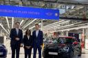 Secretary of state for business and trade, Kemi Badenoch with Milan Nedeljkovic, a BMW board member,  and Dr Markus Grüneisl, chief executive BMW Group UK, at the investment announcement earlier this month