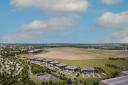 Green light for Bicester Motion’s new £50 million Innovation Quarter to boost future pioneering mobility discovery – aerial CGI looking across the 444-acre estate, racetrack and airfield showing seven new HQ buildings