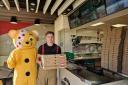Bicester fireman with Pudsey Bear in Papa Johns, Bicester