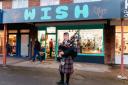 Peter Street, Caledonian Pipes and Drums plays bagpipes to commemorate the opening of the WISH climate action museum in Kidlington
