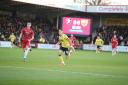 Billy Bodin chases the ball down for Oxford United