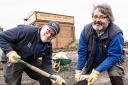 Matt Hudson and Roger Jones shovelling ash into bags at Didcot Railway Centre