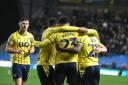 Oxford United players celebrate with Josh Murphy after his first league goal for the club