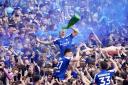 Ipswich’s Harry Clarke celebrates their promotion to the Premier League after a pitch invasion greeted the final whistle of their 2-0 victory over Huddersfield on Saturday (Zac Goodwin/PA)
