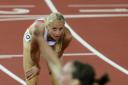 Hannah England looks dejected as Laura Weightman celebrates silver