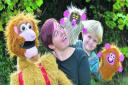 Emma Boor with Funky Monkey and her Mo Harry, four, with two Funky Monkey hand puppets