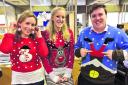 Keeley Rogers, Naomi Herring and Luke Sproule with festive knitwear