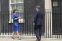 Samantha and David Cameron return to Downing Street