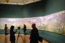 Panoramic view: visitors marvel at Monet's Agapanthus Triptych of 1916-1919 at the Royal Academy