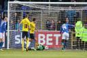 Goalkeeper Benji Buchel lies helpless on the floor as Danny Hylton clears off the line during Oxford United's 2-0 win at Carlisle United Picture: Richard Parkes