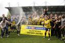 Oxford United celebrate promotion on the pitch  Picture: David Fleming
