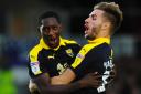 Shandon Baptiste (left) is congratulated by Luke Garbutt after putting Oxford United 2-0 ahead after only four minutes at Newport County   Picture: Tom Sandberg/Pinnacle