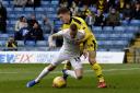 Josh Ruffels challenges Peterborough United's Joe Ward  Picture: David Fleming