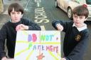 Parking protest . . . Pupils Rory Campbell-Smith and William Ayres with a banner