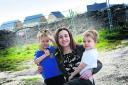 Karen Waggott, with twin boys, Jamie, left, and Luke, six, who launched the petition for an archaeological trail on the Great Western Park estate