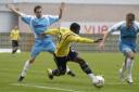 Yemi Odubade is trapped by Tony James and Paul Hurst