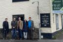 The steering committee group by The Crown pub in Marcham which they intend to run as a community business