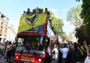 Oxford United players enjoy the open-top bus parade