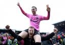 Marc Leonard (on shoulders) celebrates promotion with Northampton Town