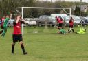 Josh Harper slides in to score Saxton Rovers Res opening goal, much to the disappointment of the Watlington players