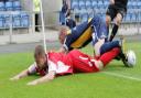United striker James Constable goes crashing to the ground with an Accrington Stanley opponent during Saturday’s goalless draw at the Kassam Stadium. It summed up a frustrating afternoon for Oxford as they struggled to find any form