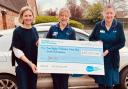 Caire Myers from Invesco presenting a cheque to Sue Ryder Palliative Care Hub South Oxfordshire in 2023