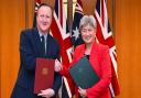 Britain’s Foreign Secretary David Cameron and Australian Foreign Minister Penny Wong after signing an agreement at Parliament House in Canberra