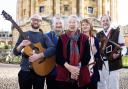 Oxford Folk Festival musicians with organiser Ginnie Redston, centre