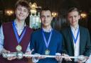 (L-R) Blake, Mustafa and Brayden, from Radley College, holding the English-Speaking Union mace.